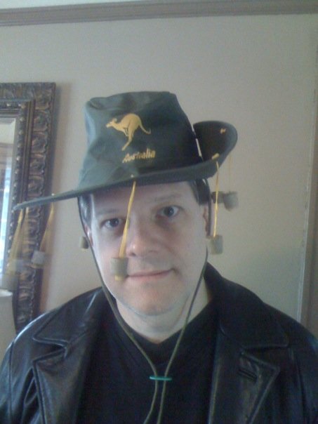 Mike had just enough time to throw on a hat and a crazy expression before getting K out the door to the parade.  I was home sick in bed.