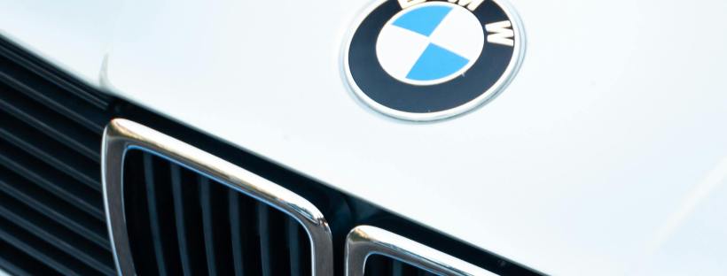 Detailed view of a vintage BMW car grille showcasing iconic design with chrome features.